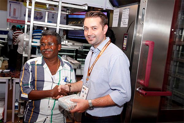 CHAMUNDE representative with a visiting baker at Bakexpo