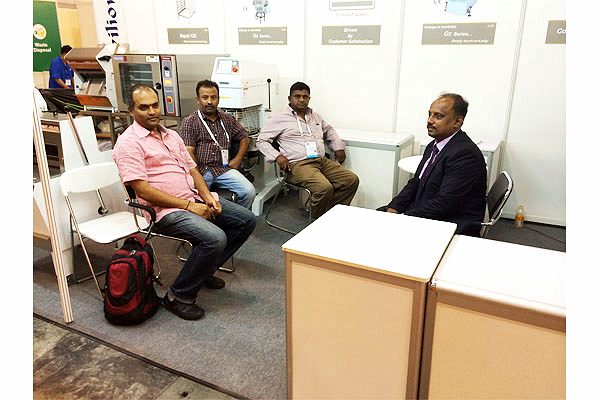 CHAMUNDE representatives at a Singapore trade event