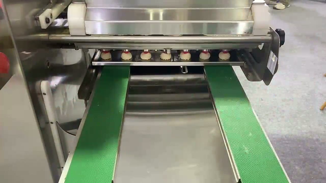 Cookie Jet depositor with green conveyor belt