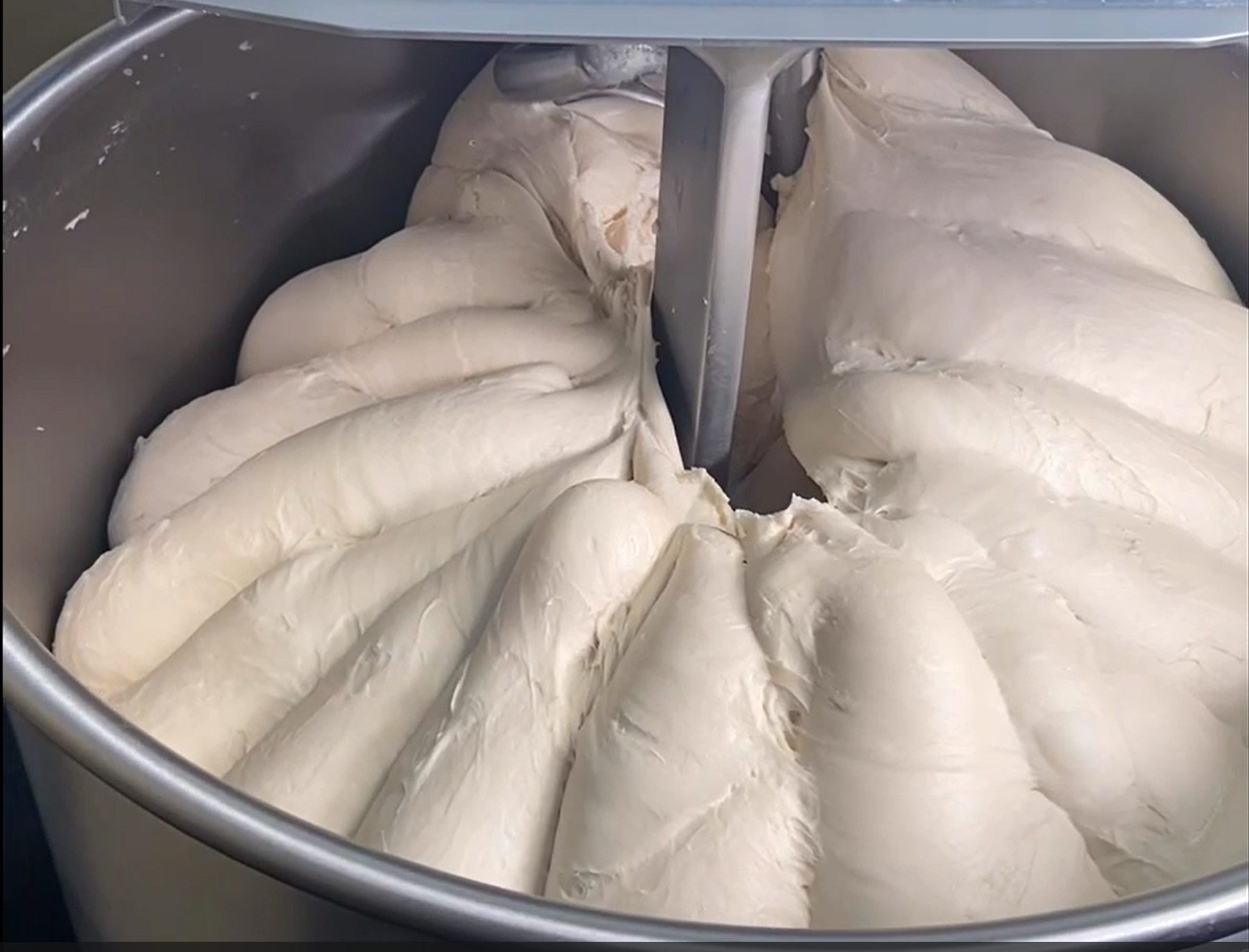 Fully developed dough in the bowl of a CHAMUNDE spiral mixer